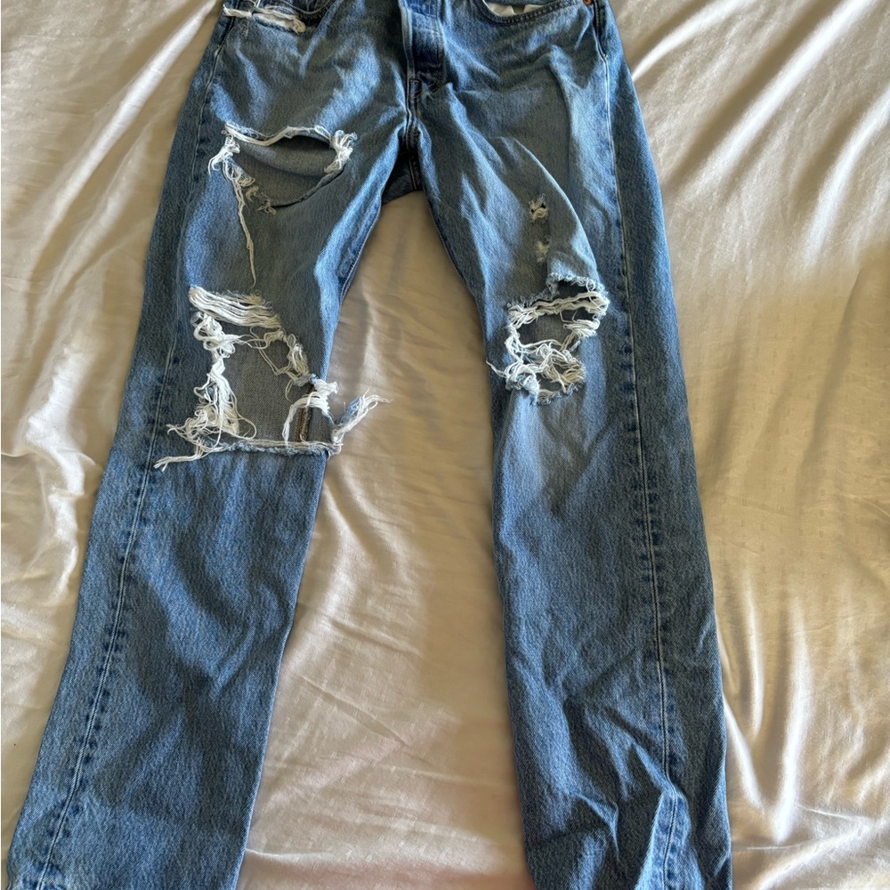 Woman’s Levi size 26 Distressed Jeans